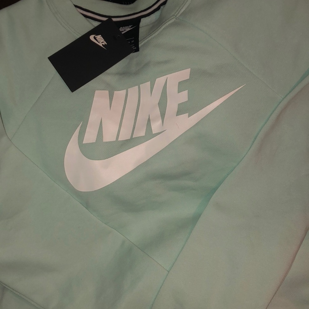 Light teal Nike’s long sleeve sweater